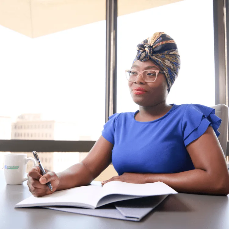 Woman taking notes in a meeting