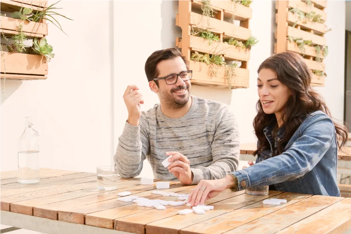 Couple playing dominoes